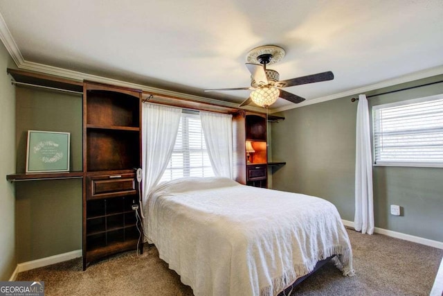 carpeted bedroom with multiple windows, crown molding, and ceiling fan