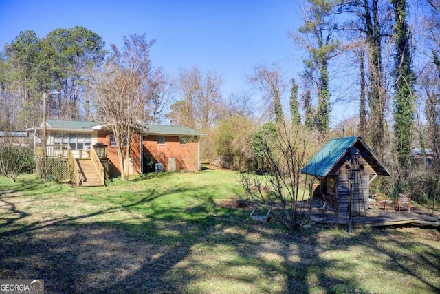 view of yard with a deck