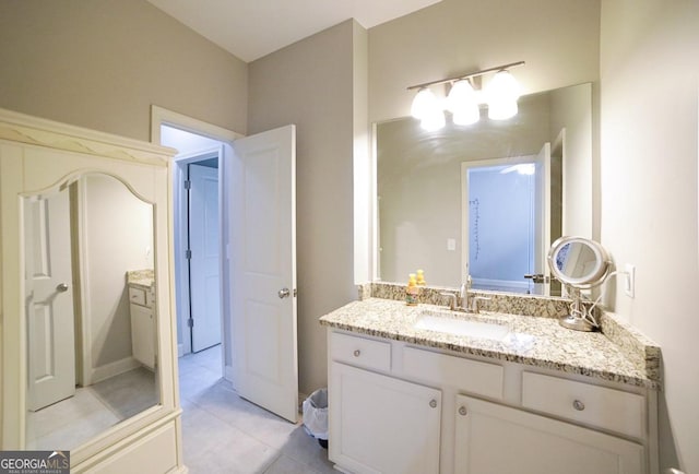 bathroom featuring tile patterned flooring and vanity