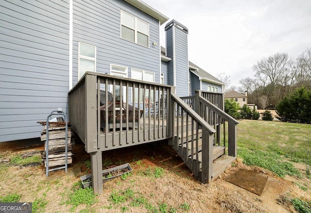 wooden terrace with a yard