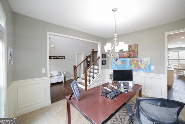 home office featuring a notable chandelier