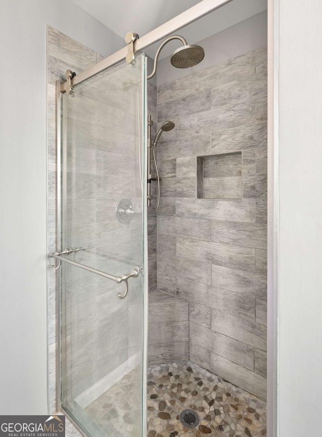 bathroom featuring an enclosed shower