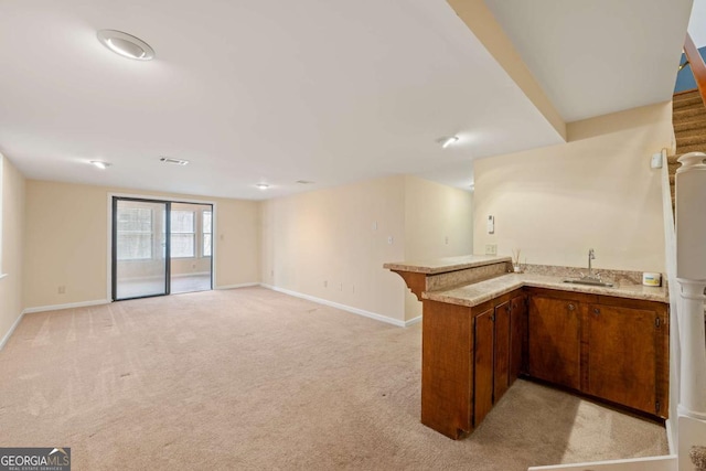 bar with sink and light colored carpet