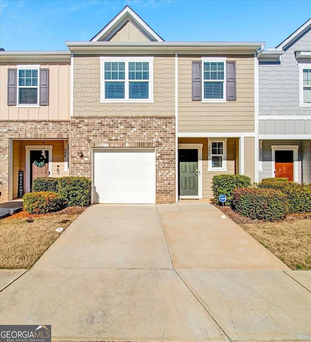 townhome / multi-family property featuring a garage