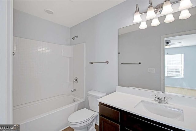 full bathroom with ceiling fan, shower / tub combination, vanity, and toilet