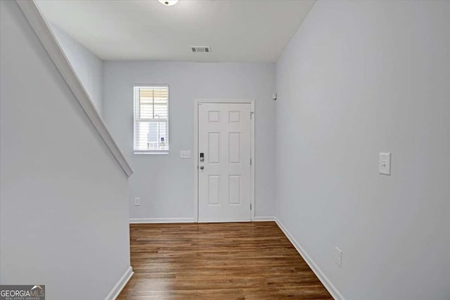 foyer entrance with dark hardwood / wood-style floors