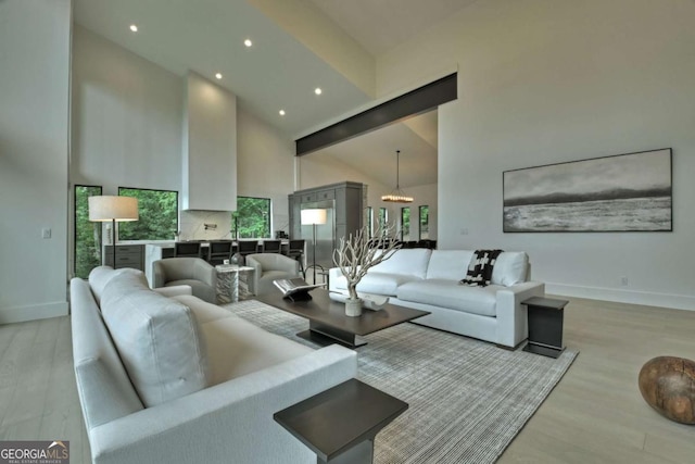 415 Green Ridge Trl, Blue Ridge, GA 30513 - living room featuring high vaulted ceiling, light hardwood / wood-style floors, and a chandelier