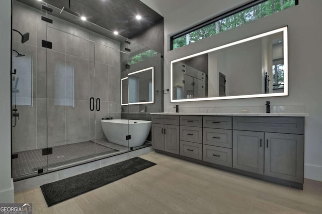 415 Green Ridge Trl, Blue Ridge, GA 30513 - bathroom with hardwood / wood-style floors, plus walk in shower, and vanity