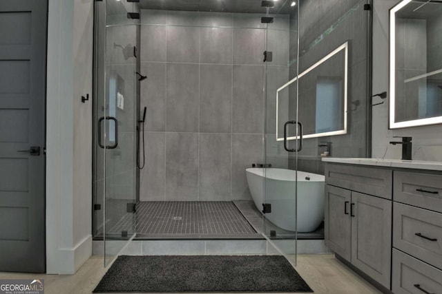 415 Green Ridge Trl, Blue Ridge, GA 30513 - bathroom featuring wood-type flooring, plus walk in shower, and vanity