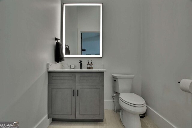 415 Green Ridge Trl, Blue Ridge, GA 30513 - bathroom featuring toilet, wood-type flooring, and vanity
