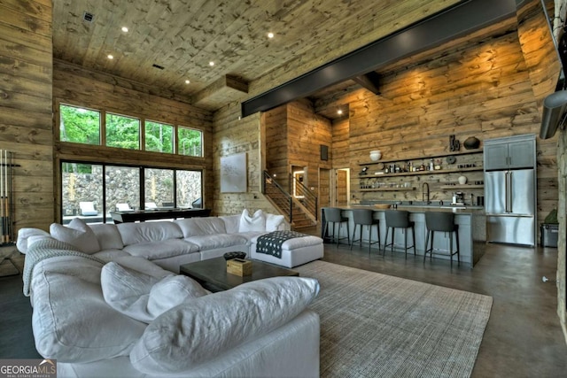 415 Green Ridge Trl, Blue Ridge, GA 30513 - living room featuring a towering ceiling, sink, and wooden walls