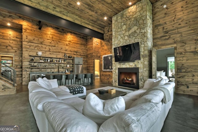 415 Green Ridge Trl, Blue Ridge, GA 30513 - living room with wooden ceiling, wood walls, a towering ceiling, and a fireplace