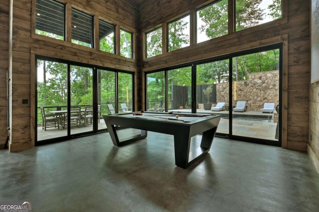 415 Green Ridge Trl, Blue Ridge, GA 30513 - playroom with a high ceiling, concrete flooring, billiards, and wood walls