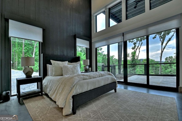 415 Green Ridge Trl, Blue Ridge, GA 30513 - bedroom featuring a high ceiling, concrete flooring, and access to outside