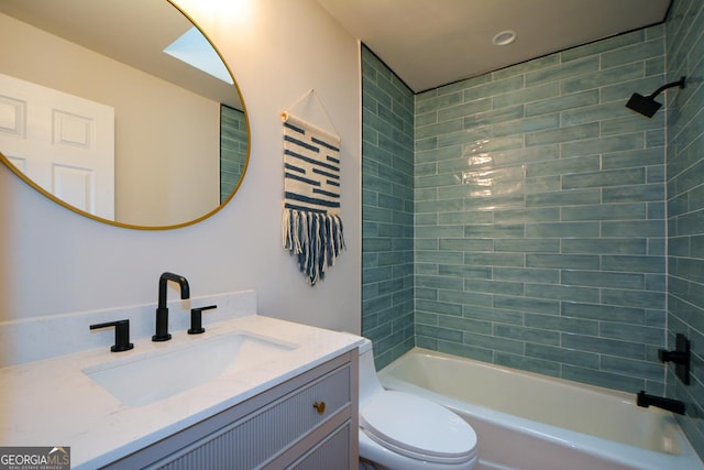 bathroom with toilet, shower / bathtub combination, and vanity