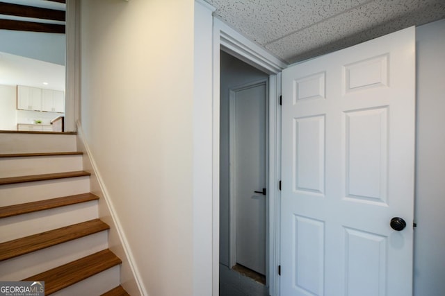 stairway with baseboards