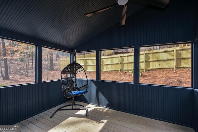 sunroom / solarium with lofted ceiling and ceiling fan