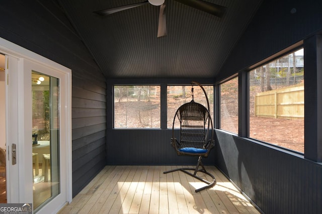 sunroom / solarium with vaulted ceiling