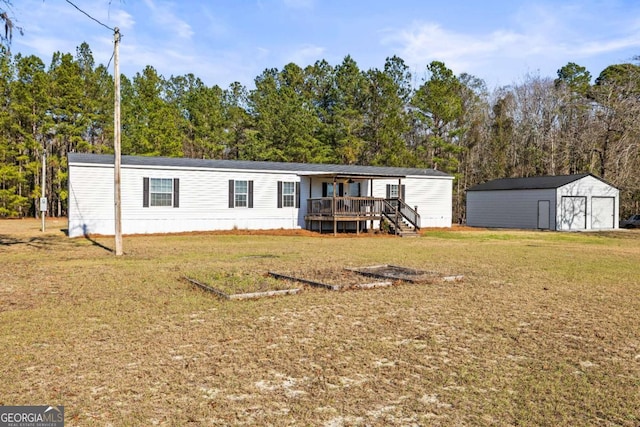 view of front of house featuring a storage unit, a deck, and a front lawn