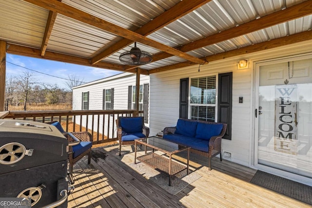 deck featuring a grill, an outdoor hangout area, and ceiling fan