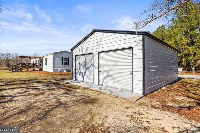 view of outdoor structure with a garage