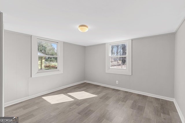 empty room with light hardwood / wood-style floors