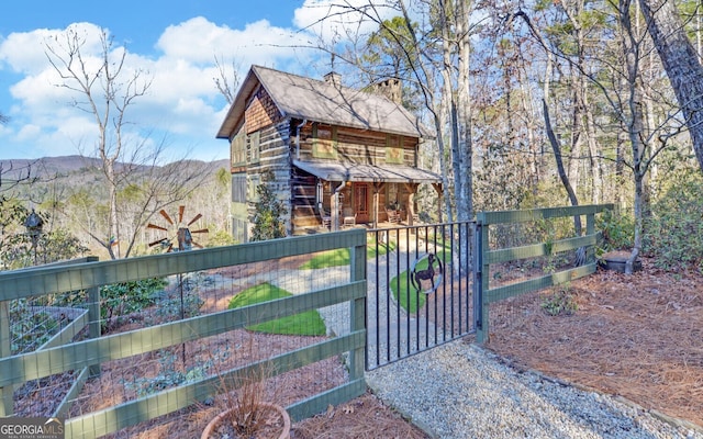 view of gate with a mountain view