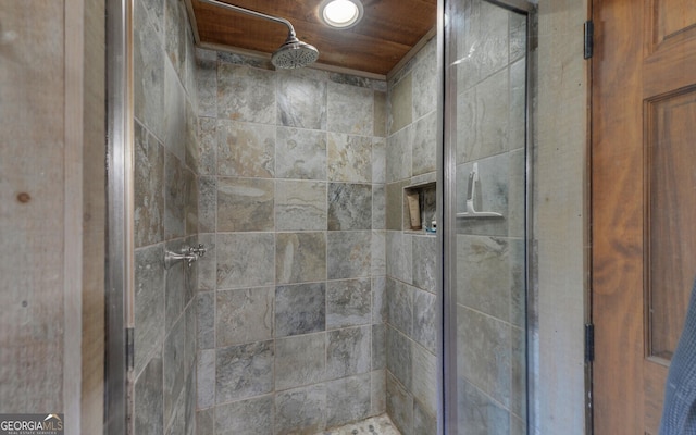 bathroom with a tile shower