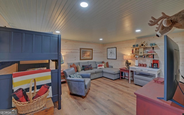 living room featuring light hardwood / wood-style floors and wooden ceiling