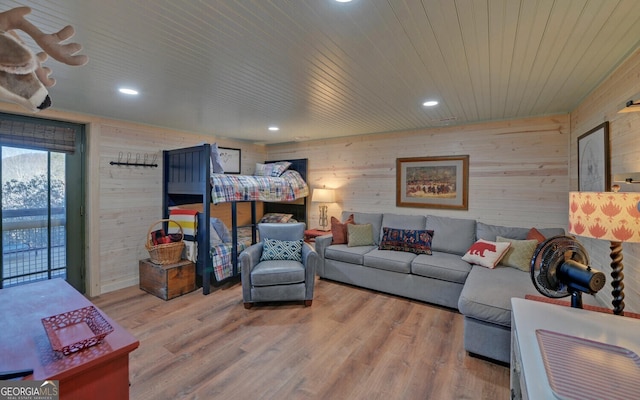 bedroom with hardwood / wood-style floors, wooden ceiling, and wood walls