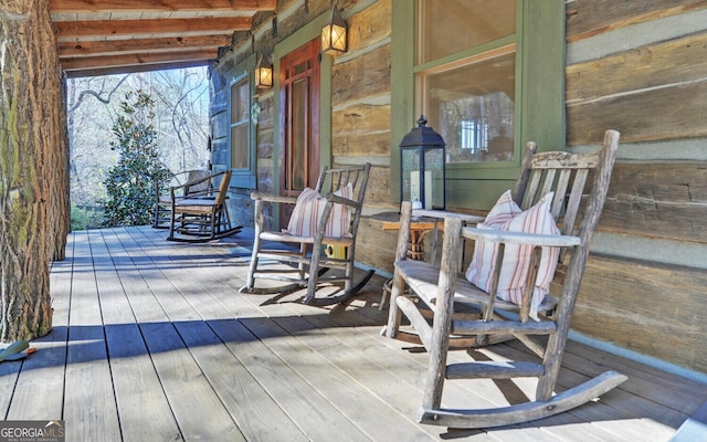 wooden terrace with a porch