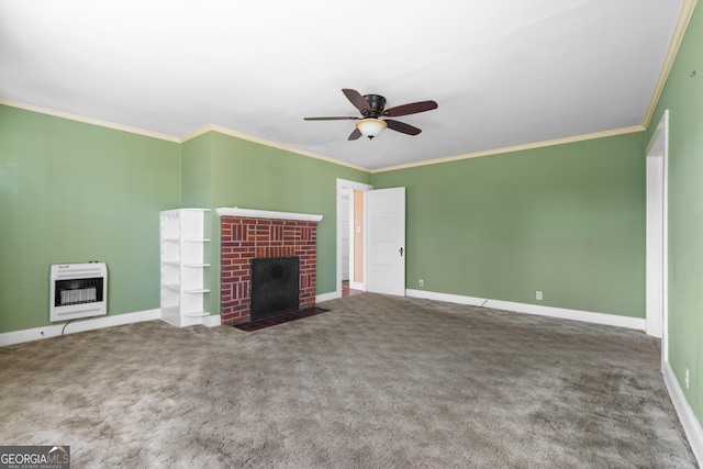 unfurnished living room with ornamental molding, a fireplace, carpet floors, and heating unit