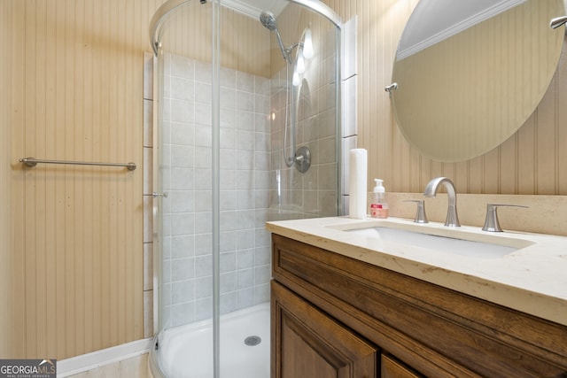 full bath with a shower stall and vanity