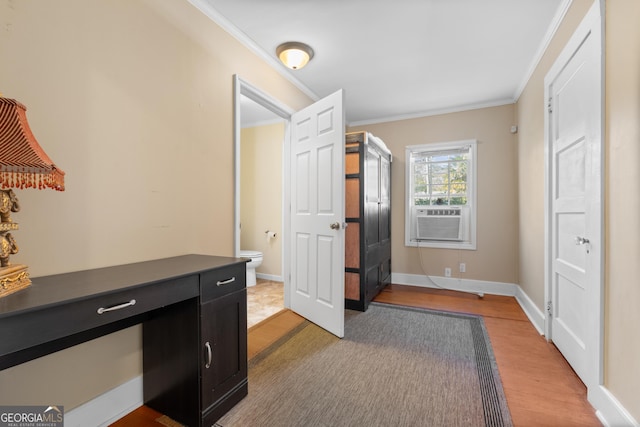 office area featuring light wood-style floors, cooling unit, crown molding, and baseboards