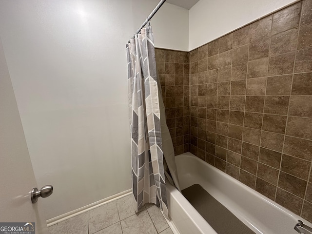 bathroom with tile patterned flooring and shower / bath combo with shower curtain