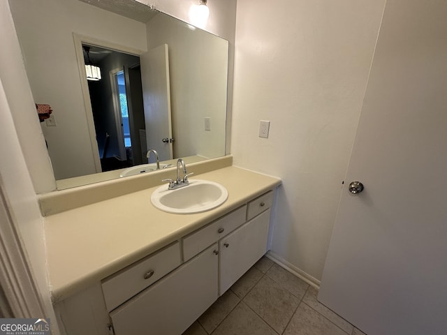 bathroom featuring tile patterned flooring and vanity