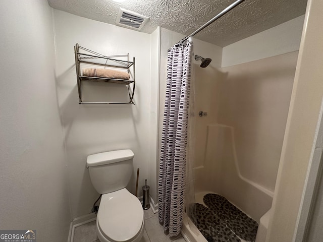 full bath with toilet, a shower stall, and visible vents