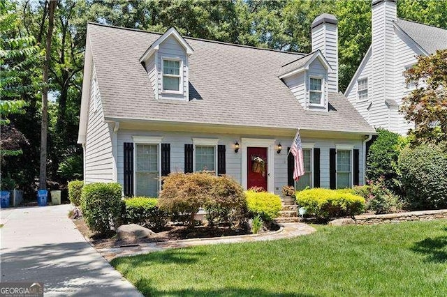 cape cod-style house with a front lawn