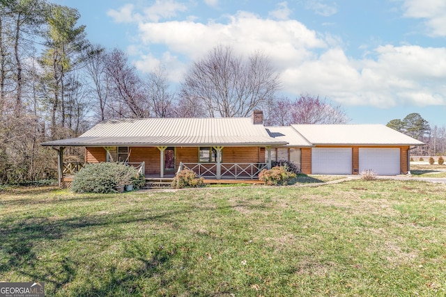 ranch-style home with a garage, a front yard, and a porch