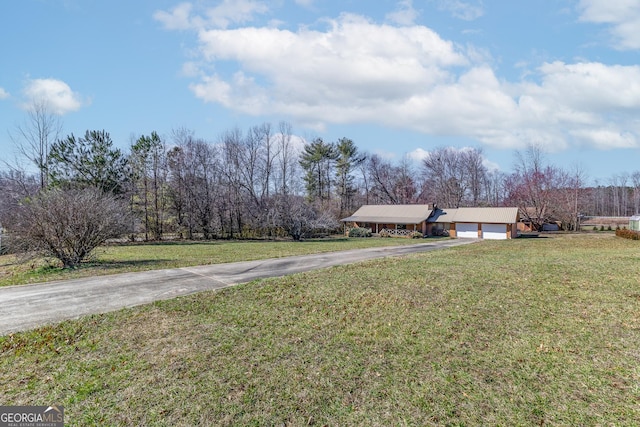 view of yard featuring a garage