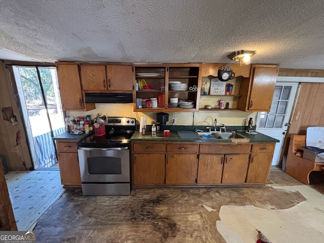 kitchen featuring stainless steel range with electric cooktop, sink, and a textured ceiling