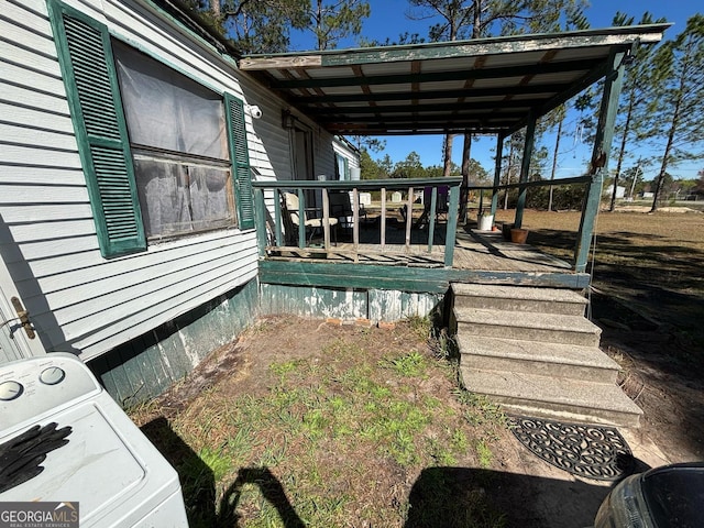 exterior space with washer / dryer