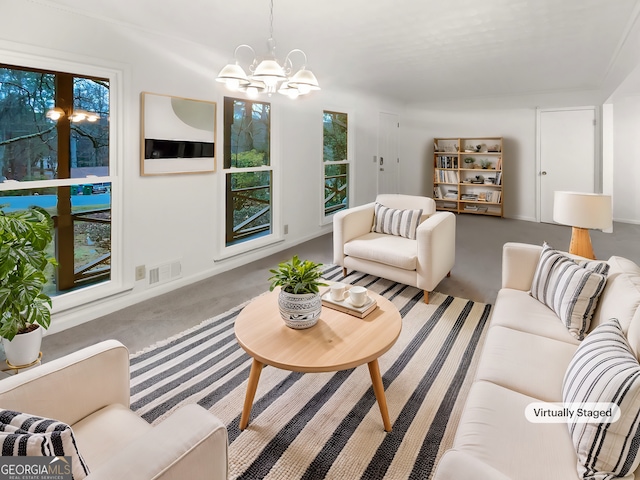 carpeted living room with a notable chandelier