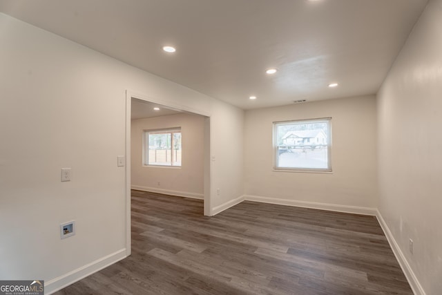 empty room featuring dark hardwood / wood-style floors