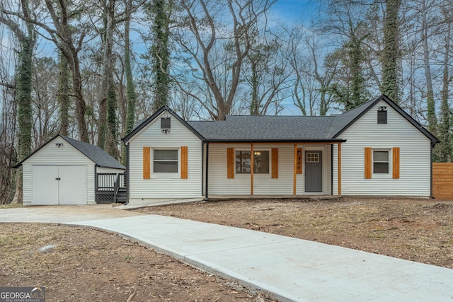 ranch-style home featuring a storage shed and a porch