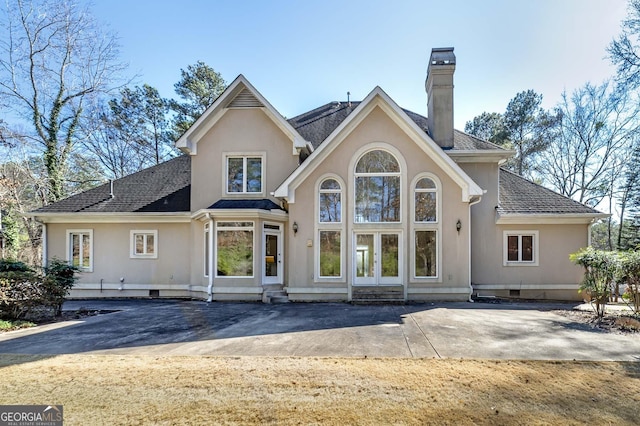 back of house with a patio