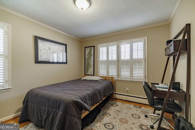 bedroom with a baseboard heating unit, crown molding, a textured ceiling, and light hardwood / wood-style flooring