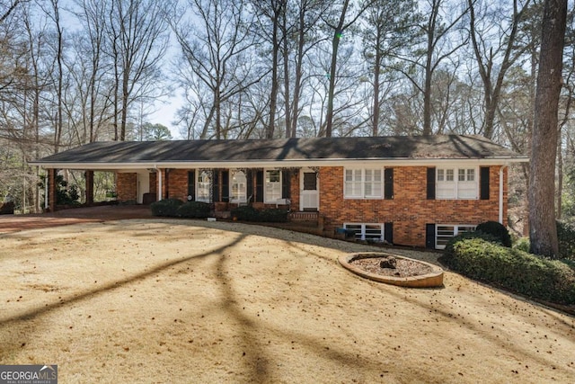 ranch-style house with a carport