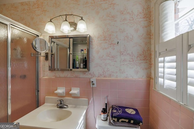 bathroom featuring tile walls and vanity