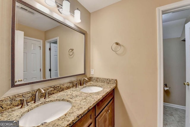 bathroom featuring tile patterned floors and vanity